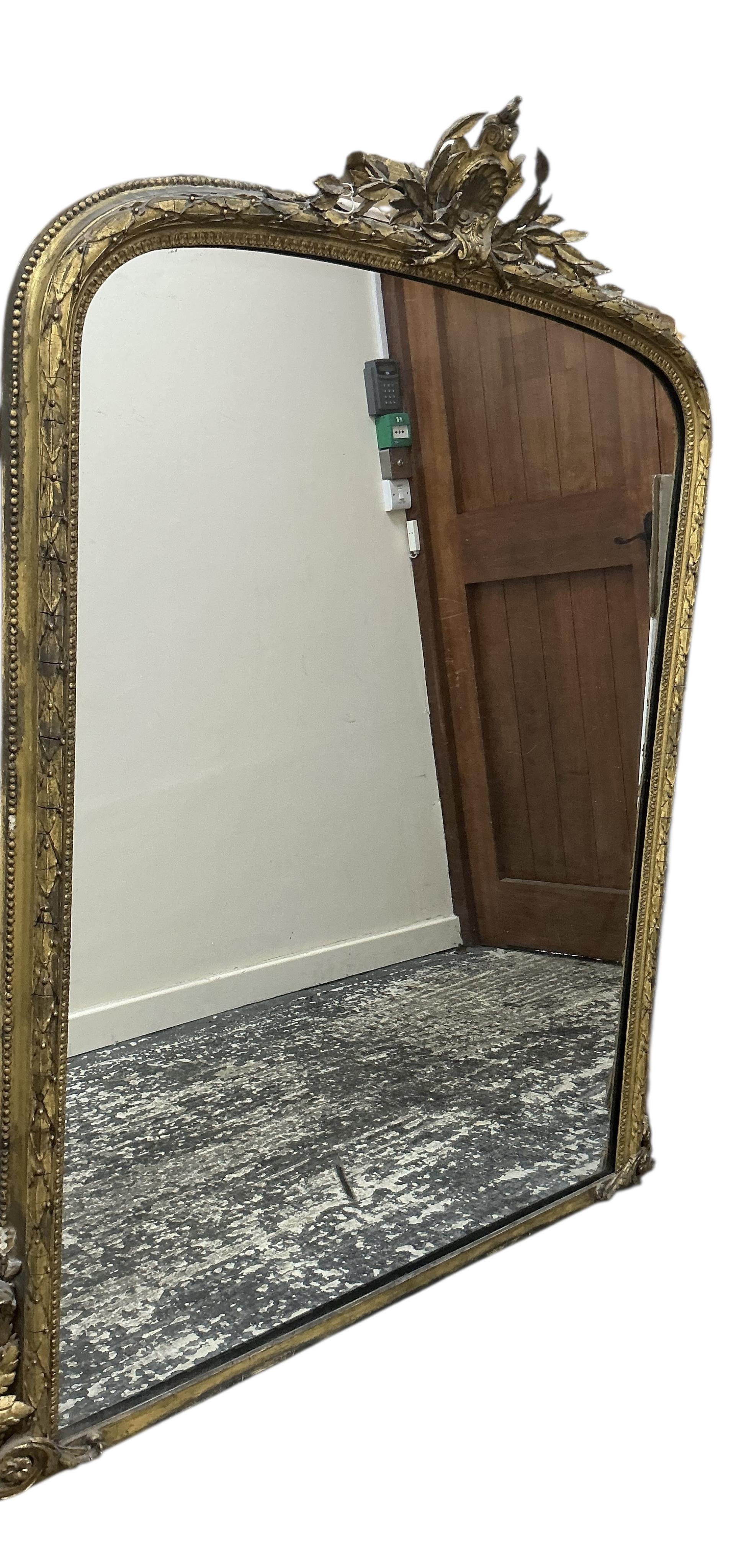 A Victorian giltwood and composition overmantel mirror, width 135cm, height 154cm
